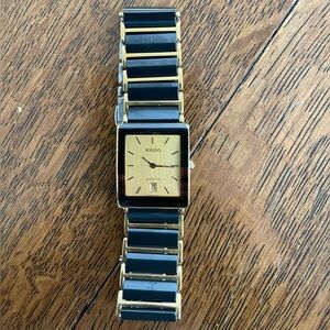 Rado Black Ceramic and Gold Swiss Watch. 2 extra links. Serial no. 31395237.